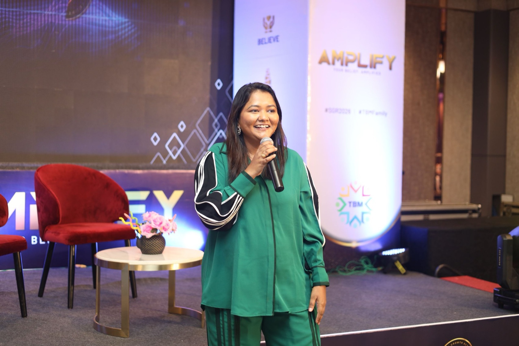 Rahath Afroz speaking on stage